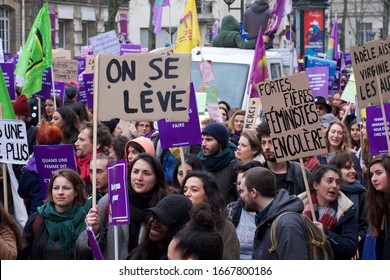 PARIS, FRANCE - MARCH 8, 2020 : Demonstration for International Women’s Day. Young women waving placard for feminism and to protest about sexual abuse and femicide.