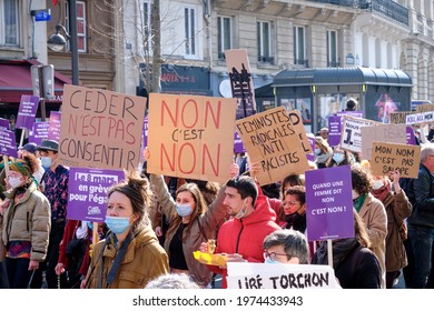 Paris, France - MARCH, 8, 2021: Feminist March and protest with cardboard signs in International Women's Day