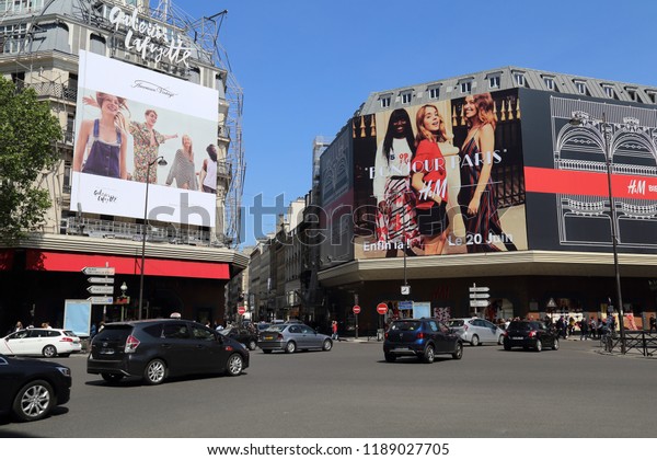 Paris,\
France - May 11, 2018: Large billboards and traffic on Rue la\
Fayette street in Paris, France on May 11,\
2018