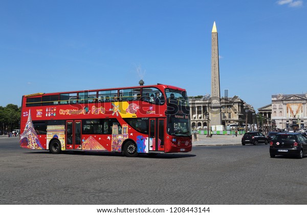 Paris, France - May 11,\
2018: Tourist bus on the Place de la Concorde in Paris, France on\
May 11, 2018