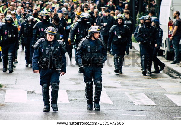 Paris France May 11, 2019 View of a riot squad\
of the French National Police in intervention during protests of\
the Yellow Jackets against the policy of President Macron in Paris\
on saturday afternoon