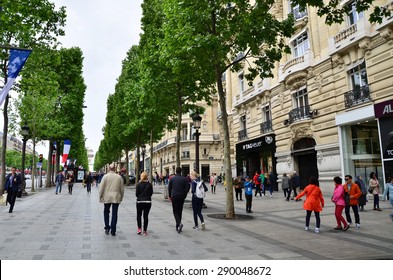Paris, France - May 14, 2015: Local And Tourists On The Avenue Des Champs-elysees On May 14, 2015.The Avenue Is One Of The Most Famous Streets In The World For Upscale Shopping.