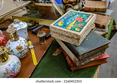 Paris, France , May 15 2022 : Flea Market Items , Old Books And Games