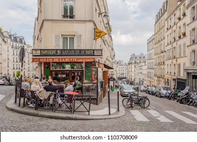 Paris / France - May 16, 2018: Friends Hang Out And Laugh And Talk At A Charming Cafe In Montmartre. 