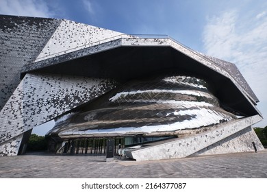 Paris, France - May, 2022: View Of Paris Philharmonic (Philharmonie De Paris) And Facade Details In Parc De La Villette. Designed By Jean Nouvel. Complex Is A Unique Architectural And Cultural Center.