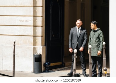 PARIS, FRANCE - MAY 21, 2016: Security Guards At The Entrance Of Givenchy Haute Couture Luxury Fashion Store In Central Paris