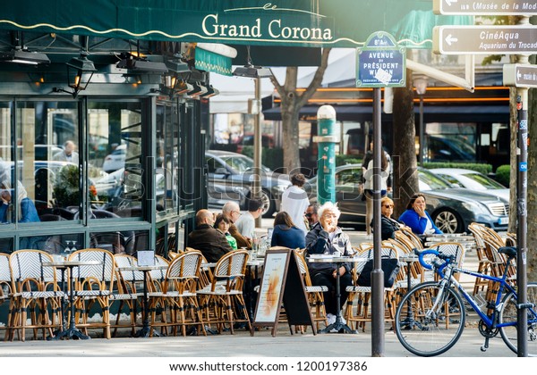 PARIS, FRANCE - MAY\
21, 2016: People having breakfast in Grand Corona Restaurant Paris\
early in the morning