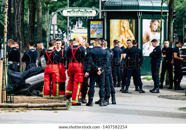 Paris France May 25,\
2019 View of French firefighter standing in the streets of Paris in\
the afternoon
