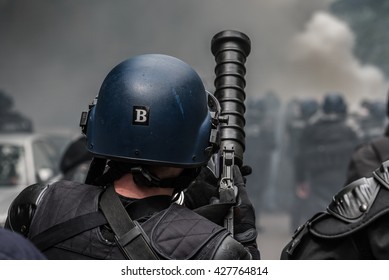 Paris, FRANCE - MAY 26, 2016 : French Police, Anti-riot Squad, With Gun Of Tear Gas During The Massive Protest Over The Labor Law Reforms.