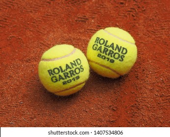 Paris, France - May 26, 2019: Two Roland Garros Grand Slam Tennis Ball On Clay Court Surface