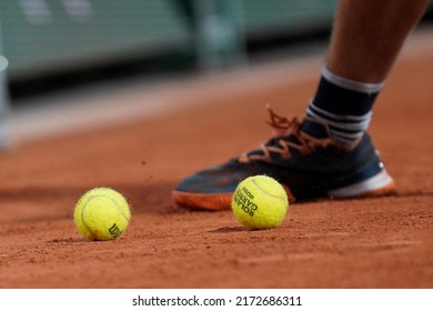 PARIS, FRANCE - MAY 30, 2022: Wilson Roland Garros tennis ball at Le Stade Roland Garros in Paris, France. Wilson is an Official Partner of the tournament and provides racquets, balls, strings