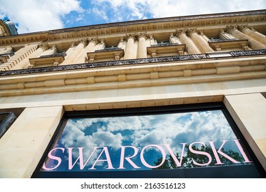 PARIS, FRANCE - MAY 9, 2021:  Swarovski store entrance at Avenue des Champs-Elysees. This famous Austrian luxury brand known for its   crystal jewelry and watches was founded in 1895. 