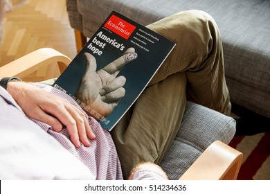 PARIS, FRANCE - NOV 10, 2016: Man Reading The Economist Magazine With America Best Hope Cover Illustrating US President Election - Donald Trump Is The 45th President Of United States Of America