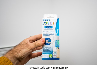 Paris, France - Nov 11, 2020: POV Male Hand Holding Against White Background New Philips Avent Anti-colic Baby Bottle For Newborn