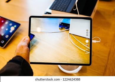 PARIS, FRANCE - NOV 7, 2018: Customer POV Personal Perspective Experiencing New Apple IPad Pro Tablet With Face ID, Neural Engine And Thin Completely Redesigned Body Taking Photo With Rear Camera