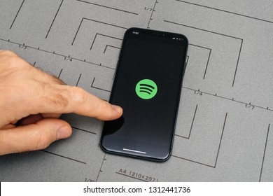 PARIS, FRANCE - NOV 9, 2017: Man POV Personal Perspective On The Latest IPhone X XS With Hand Pressing The Spotify Button