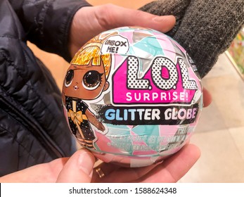 Paris, France - November 06, 2019: Hands Holding New Ball Toy LOL. Cute Little L.O.L. - Lil Outrageous Littles Surprise Toy From MGA Entertainment, Also Create Toys: Lalaloopsy