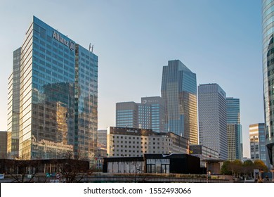 Paris, France - November 17, 2018: Cityscape with skyscrapers of La Defense lit by sunset light. Modern business and residential area in the near suburbs of Paris