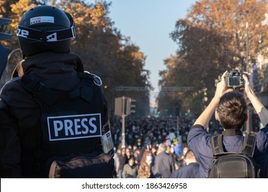 Paris, France - November 28th 2020 : At The March Against The Global Security Law, Journalist Wearing A Helmet Watching At The Huge Crowd Coming In