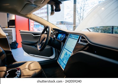 PARIS, FRANCE - NOVEMBER 29, 2014: The Interior Of A Tesla Motors Inc. Model S Electric Vehicle With Its Large Touchscreen Dashboard.