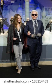 PARIS, FRANCE - NOVEMBER 9, 2011 - Vanessa Paradis and Karl Lagerfeld during the light period of Paris for Christmas. They inaugurated the store windows of the department store Printemps Haussmann.