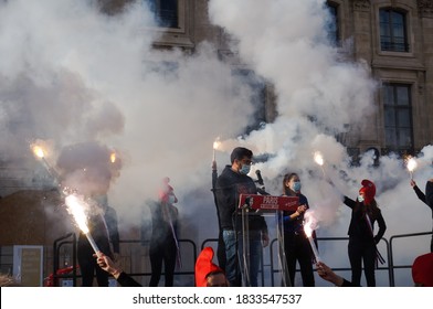 Paris, France - Oct. 10, 2020 - Young protesters wave smoke bombs after LMPT Vice-President Albéric Dumont's address, at Marchons Enfants' demonstration against the bioethics and procreation bill