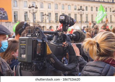 Paris, France - Oct. 10, 2020 - A reporter of the public media France Télévisions, among other journalists, recording for his channel with a big Sony TV camera, at Marchons Enfants' manifestation