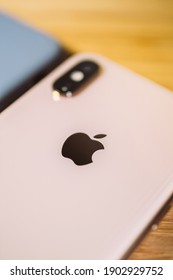 Paris, France - Oct 2, 2018: Close-up of the new Apple Computers iPhone smartphone with focus on the logotype insignia - tilt-shift lens used