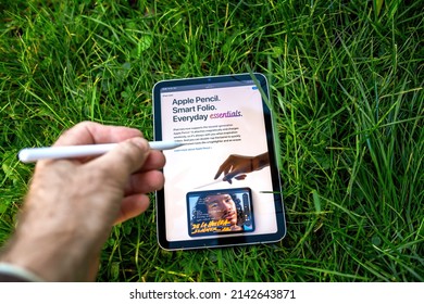 Paris, France - Oct 21, 2021: Male Hand Writing Surfing Web On The Latest IPad Pro Tablet With Pencil Device Input