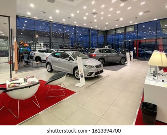 Paris, France - Oct 25, 2019: Wide Angle View Of Empty Car Dealership Showroom Interior With Multiple Seat Cars Inside And Focus On Black Silver Ibiza Four Door Model