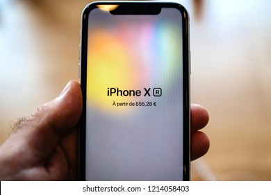 PARIS, FRANCE - OCT 26, 2018: Closeup macro of the new iPhone XR smartphone in Apple Store Computers during the launch day with price and logo