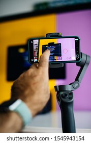 Paris, France - Oct 29, 2019: POV Vlogger Filming On Smartphone Using DJI OSmo 3 Gimbal And FilMic App The New Facebook Portal Smart Device Facebook That Provide Video Chat Facebook Messenger WhatsApp