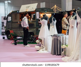 PARIS, FRANCE - OCT 6, 2018: Wedding Exhibition Paris 2018 With People -customers Admiring Dresses Near Food Truck