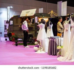 PARIS, FRANCE - OCT 6, 2018: Wedding Exhibition Paris 2018 With People -customers Admiring Dresses Near Food Truck