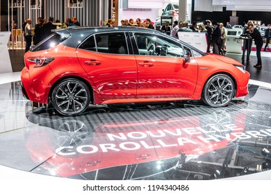 Paris, France, October 02, 2018: metallic red new Toyota Corolla Hybrid at Mondial Paris Motor Show, produced by Japanese automaker, Toyota booth - Shutterstock ID 1194340486