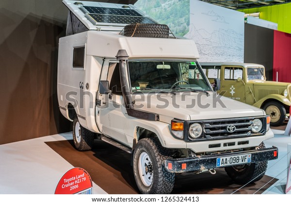 Paris, France, October 02, 2018: vintage\
Toyota Land Cruiser HZJ 79 2006 glossy and shiny old classic retro\
off-road truck car at Mondial Paris Motor\
Show