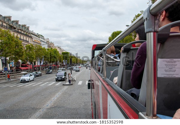 PARIS, FRANCE - OCTOBER 04, 2013: The Champs-Élysées\
from a tour bus.