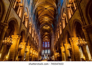 PARIS, FRANCE - OCTOBER 04, 2017 - interior of the cathedral of Notre Dame with suggestive illuminated arches and glass windows...