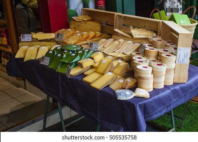 PARIS, FRANCE -OCTOBER 1 : French Cheese Shop With Dozens Of Kinds Of Chees And Customers Choosing Among Them On October 1, 2016 In Paris, France