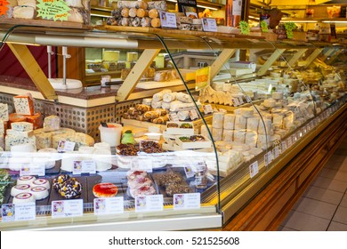 PARIS, FRANCE -OCTOBER 1 : French Cheese Shop With Dozens Of Kinds Of Chees And Customers Choosing Among Them On October 1, 2016 In Paris, France