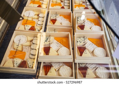 PARIS, FRANCE -OCTOBER 1 : French Cheese Shop With Dozens Of Kinds Of Chees And Customers Choosing Among Them On October 1, 2016 In Paris, France