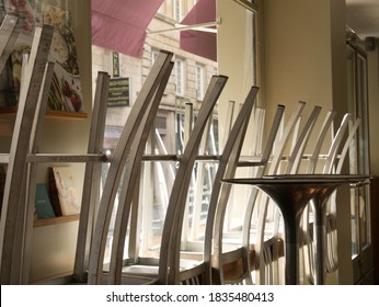 Paris, France - October 10 10 2020: Chairs On The Tables Of Cafes Closed Due To Covid 19. 