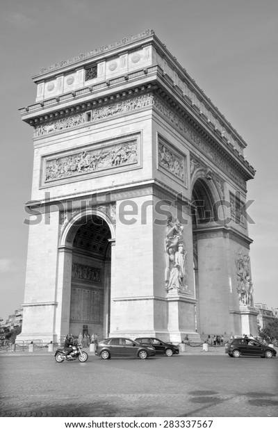 PARIS, FRANCE OCTOBER\
19: The Triumphal Arch de l Etoile ( arc de triomphe) . The\
monument was designed by Jean Chalgrin in 1806 in Paris, France on\
October 19, 2014