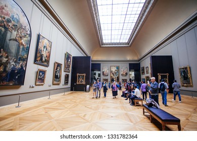 Paris, France - October 2, 2016: Tourists visit art gallery in the Louvre Museum. The Louvre Museum is one of the largest and most visited museums worldwide