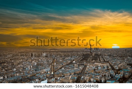 View of Paris with Eiffel tower silhouette at sunset