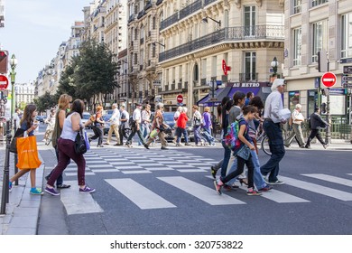 PARIS, FRANCE, On AUGUST 26, 2015. Picturesque City Landscape In The Summer Sunny Day. People Stand Cross The Street At The Crosswalk