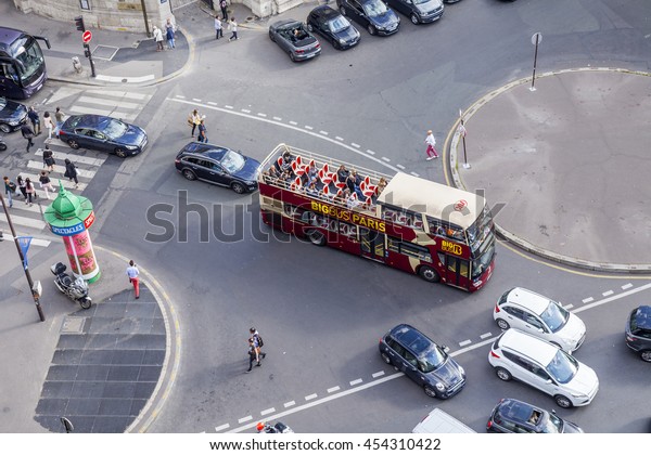 PARIS, FRANCE, on JULY 5, 2016. A typical\
urban view from the survey platform of the Gallery department store\
Lafayette. Excursion bus in the\
street