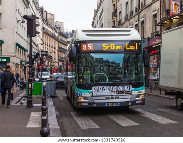 PARIS,\
FRANCE, on OCTOBER 26, 2018. Urban view. The bus goes down the\
street. Beautiful buildings are reflected in\
glass