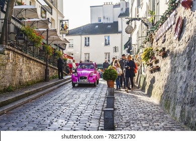 PARIS, FRANCE, On October 30, 2017. Autumn City Landscape. Stylish Beautiful Houses Make An Architectural Complex Of The Street On Montmartre. Pink A Retro The Car Goes On The Road