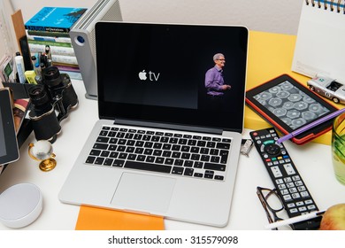 PARIS, FRANCE - SEP 10, 2015: Apple Computers Website On MacBook Pro Retina In A Creative Room Environment With Tim Cook And New Apple TV